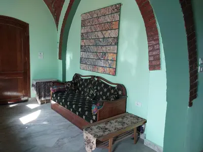 a living room with a couch and a table at Luxor Experience Guest House in Luxor