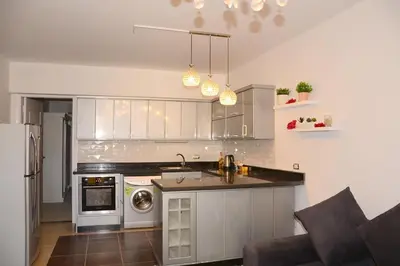 a kitchen with a stove and a dishwasher at GoEgypt Dreams in Hurghada
