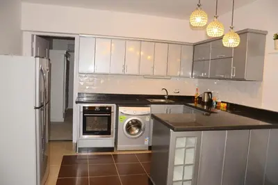 a kitchen with a washer and dryer in it at GoEgypt Dreams in Hurghada