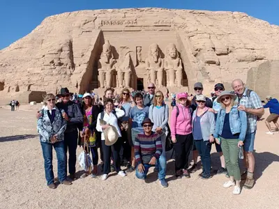 a group of people standing in front of aaraoh at JJ Guesthouse in Aswan