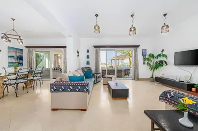 a living room with a couch and a table at Stunning villa with private heatable pool in Hurghada