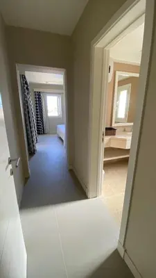 a room with a hallway with a door leading to a bedroom at SunShine Joubal view in Hurghada