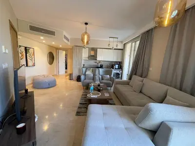 a living room with a couch and a table at SunShine Mangroovy-M10 in Hurghada
