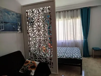 a room with a door to a bedroom with a bed at Sheraton Plaza 319 in Hurghada