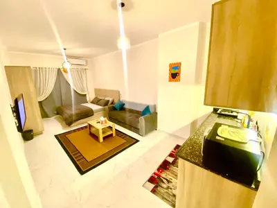 a living room with a couch and a table at Juliana Beach in Hurghada