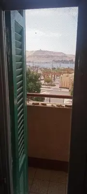 a window with a view of a desert view at شقه ب موقع متميز عل النيل in Naj‘ al ‘Amrāb