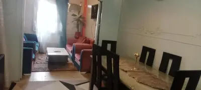 a hallway with chairs and a table in a room at شقه ب موقع متميز عل النيل in Naj‘ al ‘Amrāb