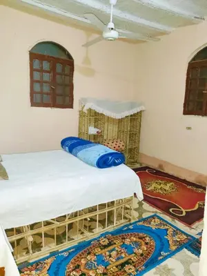a bedroom with two beds in a room at Sunset Mirage in Luxor