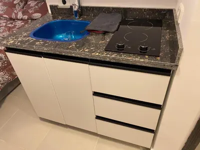 a bathroom counter with a sink and a stove at Florenza01 in Hurghada