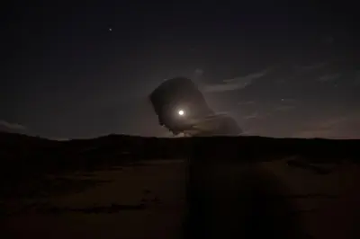 an object in the middle of the desert at night at Anoosh camp in Aswan
