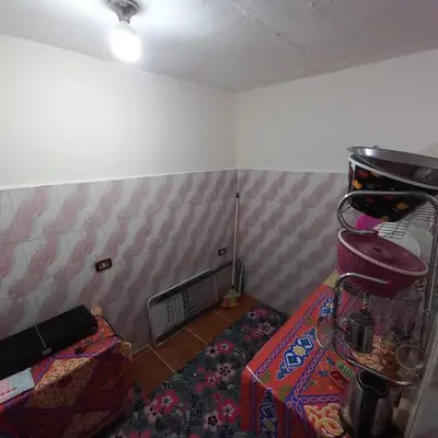 a room with a room with a bed and a fireplace at Remal City in Luxor