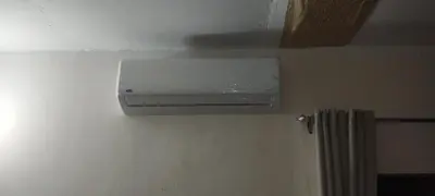 a air conditioner on the wall of a bathroom at Remal City in Luxor