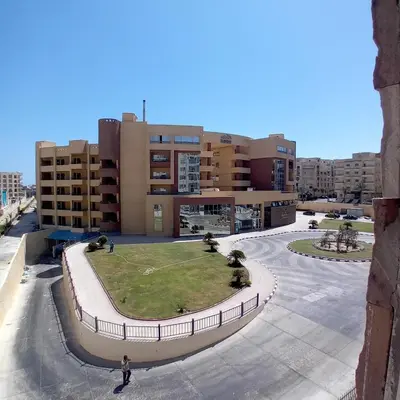 a person standing in front of a building at Tiba Golden -unit102 - Aladauy in Hurghada
