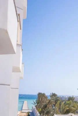 a view of the ocean from a building at Scandic Hurghada 323 in Hurghada
