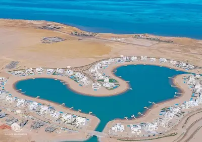 an aerial view of a resort on the beach at Ancient Hill 3BR Gouna Sea View & Priv Roof Pool in El Gouna