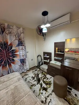a bedroom with a large painting on the wall at Marsa Alam Port Ghalib in Marsa Alam