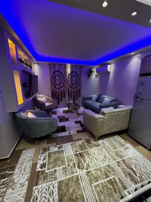 a living room with purple ceilings and couches at Marsa Alam Port Ghalib in Marsa Alam