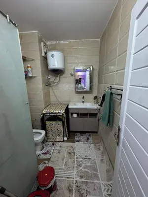 a bathroom with a sink and a toilet and a mirror at Marsa Alam Port Ghalib in Marsa Alam