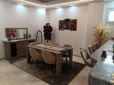 a dining room with a table and chairs at Aswan Nile View Dreams in Aswan