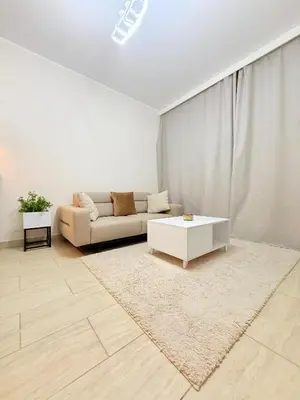 a living room with a couch and a coffee table at شقه فندقية متكامله 1 غرفه غايه فى الروعه والهدوء hurghada in Hurghada