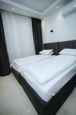 a large white bed in a hotel room at Selina Bay Resort in El Gouna