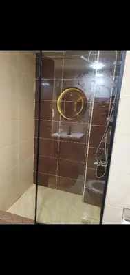 a glass door with a stove in a bathroom at Luxury Sea view studio in Hurghada