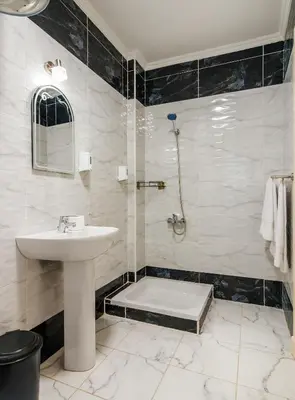a bathroom with a sink and a shower at Luxury City Center One-Bedroom Suite by Peaks in Hurghada