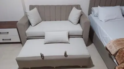 a small room with a couch and a bed at Tiba Golden Resort in Hurghada