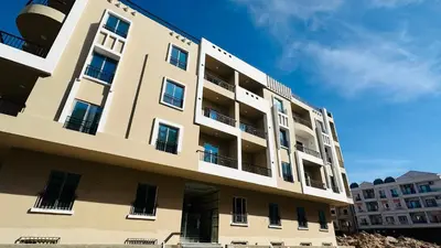 a tall building with balconies on the side of it at Hasnaa apartment in Hurghada