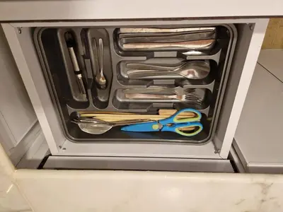 a drawer with scissors and other utensils in it at House Mountain in ‘Ezbet Abu Ḥabashi