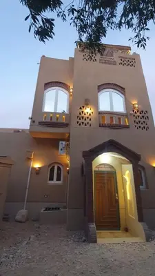 a large building with a door and a window at House Mountain in ‘Ezbet Abu Ḥabashi