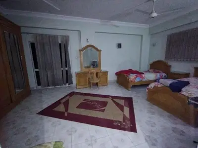 a living room with a bed and a mirror at جبل تقوق فيلا عبدالله محروس in Aswan