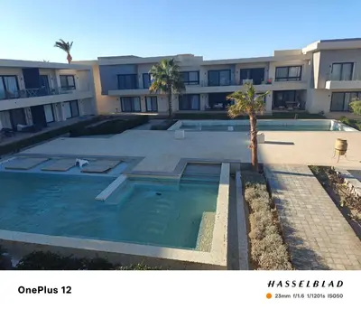 a large swimming pool in front of a building at Luxury stay in El Gouna