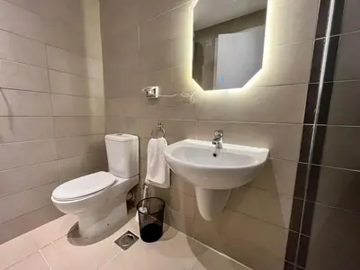 a bathroom with a toilet and a sink at Studio el Gouna holiday G cribs Compound in Hurghada