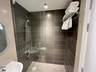 a bathroom with a shower and a sink at Studio el Gouna holiday G cribs Compound in Hurghada