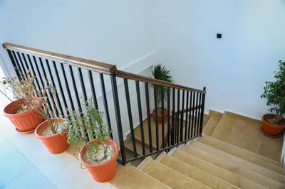 a group of potted plants sitting on a staircase at Peaceful Magawish Apartment in Hurghada