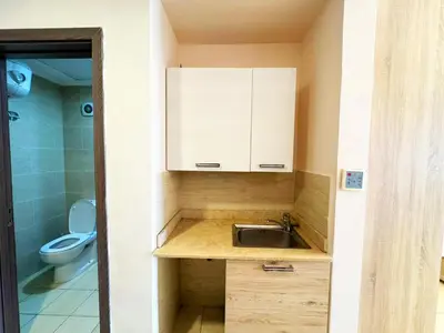 a small bathroom with a sink and a toilet at Aldau Heights in Hurghada