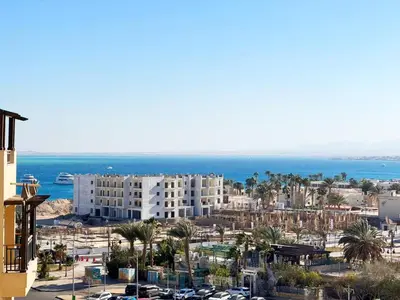 a view of a city with buildings and the ocean at Aldau Heights in Hurghada