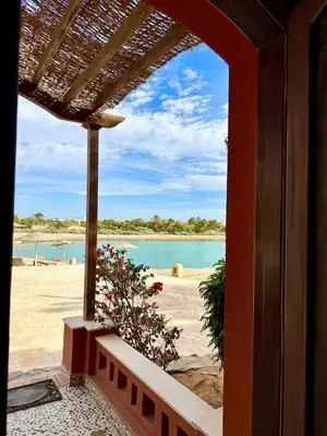 a view of the beach from a porch of a house at Exquisite 1BR Chalet with Pool and Beach Front El Gouna in Hurghada