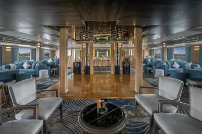 a lobby on a cruise ship with chairs and a table at Renaissance Nile Cruise - Every Saturday from Luxor To Aswan for 4 Nights , and every Wednesday from Aswan To Luxor for 3 Nights in Luxor