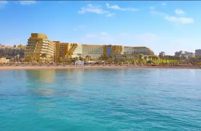 a view of a beach with hotels and the water at Hurghada in Hurghada