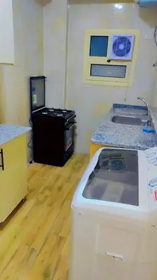 a kitchen with a counter and a sink in a room at Carrefour Hurghada city centre in Hurghada