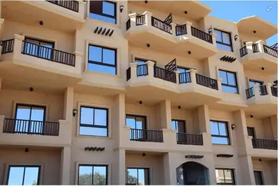 a building with balconies on the side of it at Impeccable 1-Bed Apartment in Hurghada in Hurghada