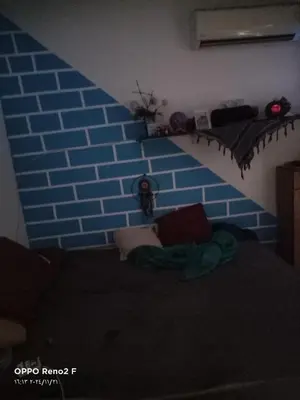 a room with a wall with a blue brick wall at happy vacation in Hurghada