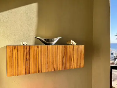 a wooden shelf on a wall with a bowl on it at A dream with a sea view in Azzurra in Hurghada