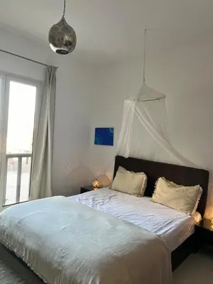 a bedroom with a bed with a canopy at A dream with a sea view in Azzurra in Hurghada