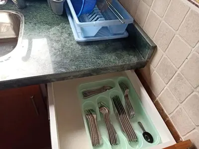 a kitchen counter with utensils in a drawer at Sea View Hurghada Holiday Home in Hurghada