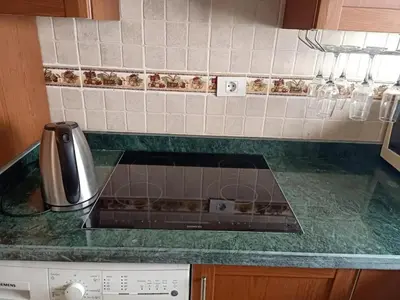 a kitchen counter top with a stove top oven at Sea View Hurghada Holiday Home in Hurghada