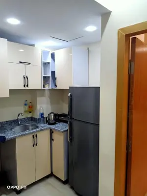 a kitchen with a refrigerator and a sink at ميراج باى in Hurghada