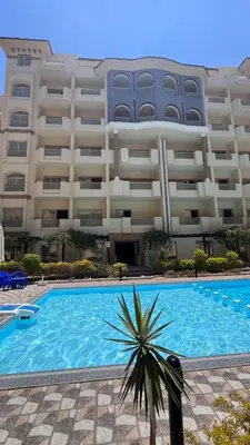 a large apartment building with a large swimming pool at Florenza Khamsin Apartments in Hurghada